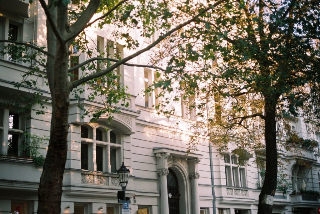 pexels-photo-18931202 Charming urban landscape in Berlin featuring classic architecture with bay windows.